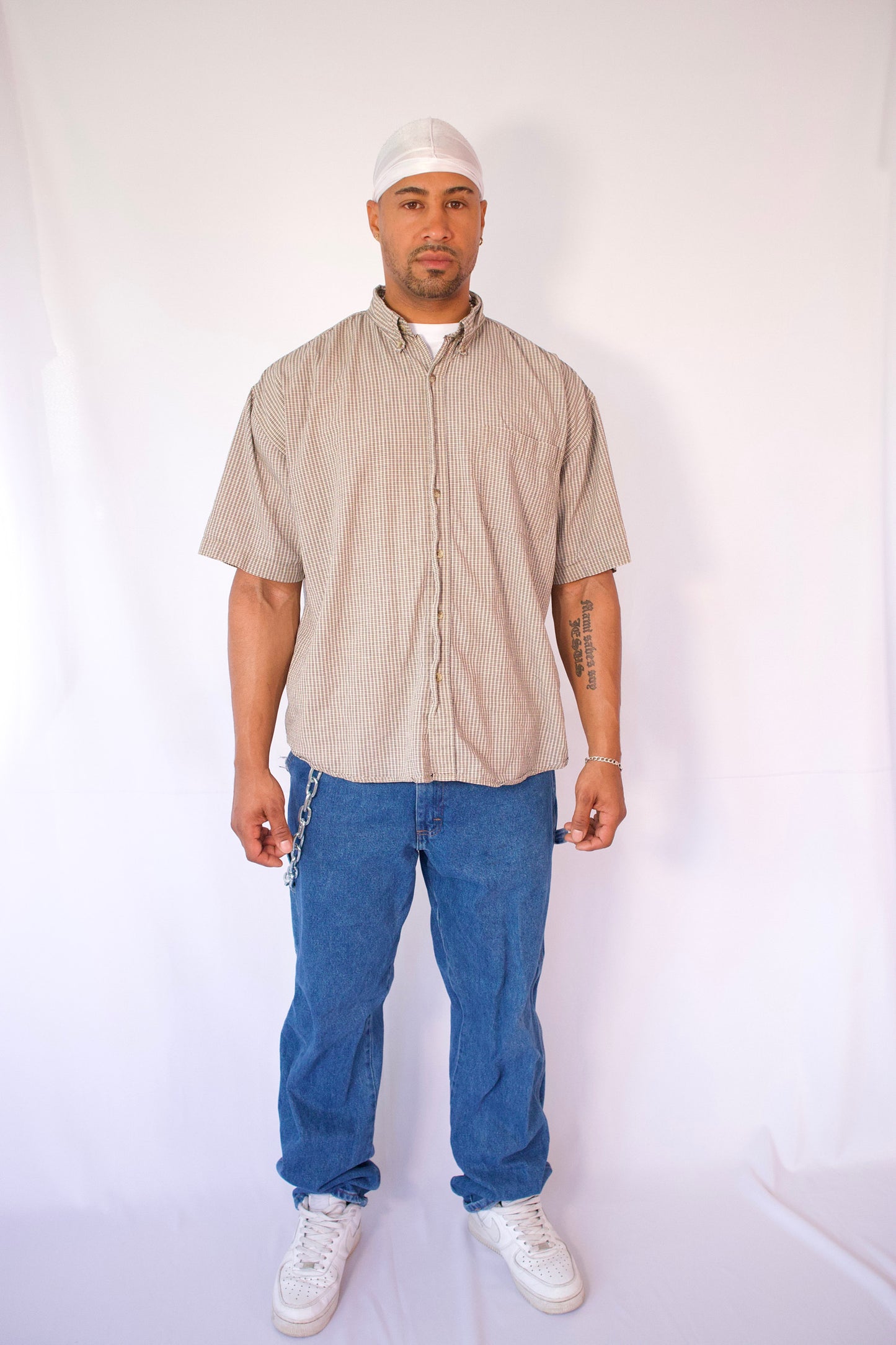 CHEMISE À MANCHES COURTES À CARREAUX BEIGE ET NOIR