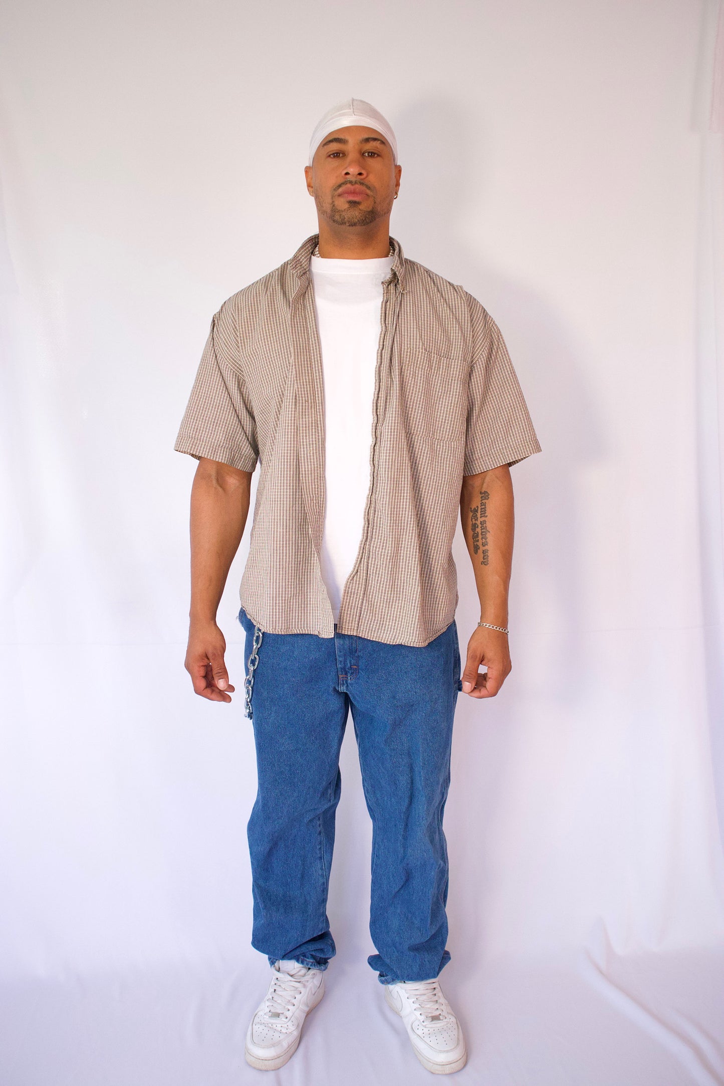 CHEMISE À MANCHES COURTES À CARREAUX BEIGE ET NOIR
