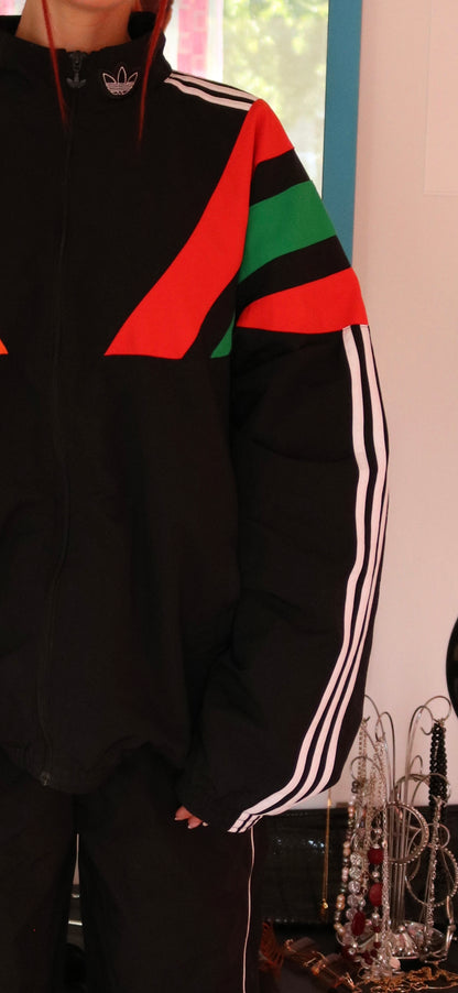 VESTE DE SPORT NOIR ROUGE ORANGE ET VERT