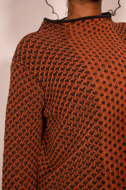 détail texture tricot orange et noir